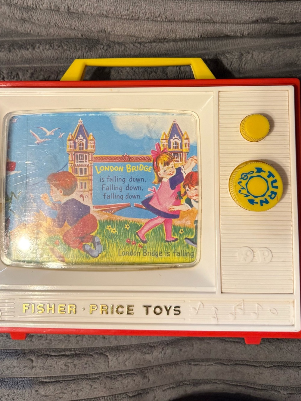 Fisher-Price Red, White, Yellow Vintage Style Music Toy with Handle